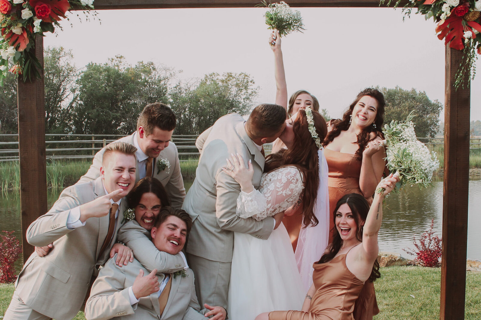 Bride and groom celebrating with their wedding party